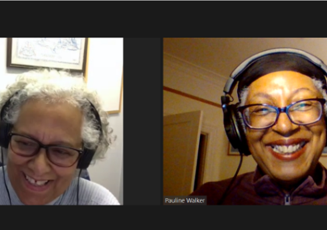 The Amplify Project podcast hosts writers Pauline Walker and Pat Cumper. Pictured on Zoom wearing headphones and smiling, both women are wearing casual clothes.